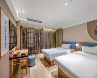 Home Inn Neo - Zhaoqing Gaoyao Polytechnic University Branch - Zhaoqing - Спальня