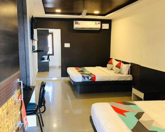 Wishotel Xpress 7 Eleven - Indore - Ložnice