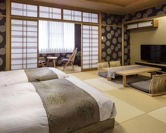 Hotel Katsuragi - Macujama - Ložnice