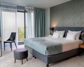 هوتل فوكاس بوزناني - بوزنان - غرفة نوم