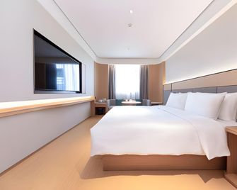 Ji Hotel Ningde Rt-Mart International Plaza - Ningde - Schlafzimmer