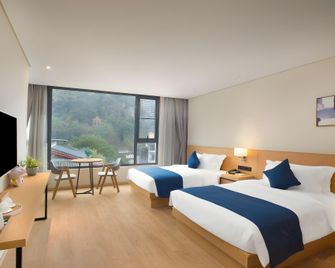 Floral Yangshuo West Street Memorize Scene Hotel - Guilin - Schlafzimmer