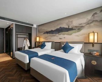 Qilin Cinema Hotel (Xinxiang East High-Speed Railway Station Branch) - Xinxiang - Schlafzimmer