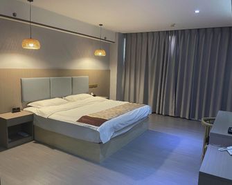 Yuxi Better Than Home Hotel - Yuxi - Habitación