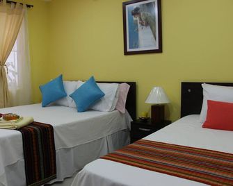 Double Room With Extra Bed - كالي - غرفة نوم