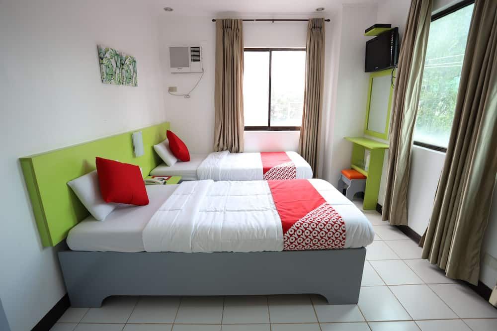 OYO 210 Apple Tree Suites - סבו סיטי - חדר שינה