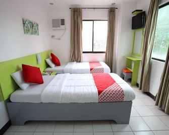 OYO 210 Apple Tree Suites - סבו סיטי - חדר שינה