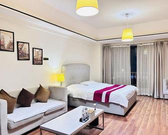 Sheyi Inn (Jiangmen Wanda Plaza) - Jiangmen - Slaapkamer