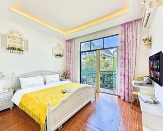 Spring Garden Hotel(Yangshuo Weststreet Lijiang Branch) - Guilin - Schlafzimmer