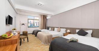 Haikou 9+1 Hotel (Meilan Airport) - Haikou - Bedroom