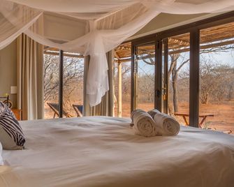 Ukuthula Bush Lodge - הודספרוט - חדר שינה