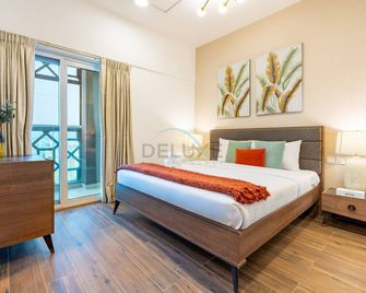 Balcony Overlooking the Community, Quick Metro Access,Short 15-Minute Drive to Ibn Battuta Mall, Viktoria Residency, Al Furjan by Deluxe Holiday Homes - Dubai - Bedroom