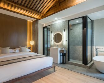 Jingli Yishu Boutique Inn - ליז'יאנג - חדר שינה