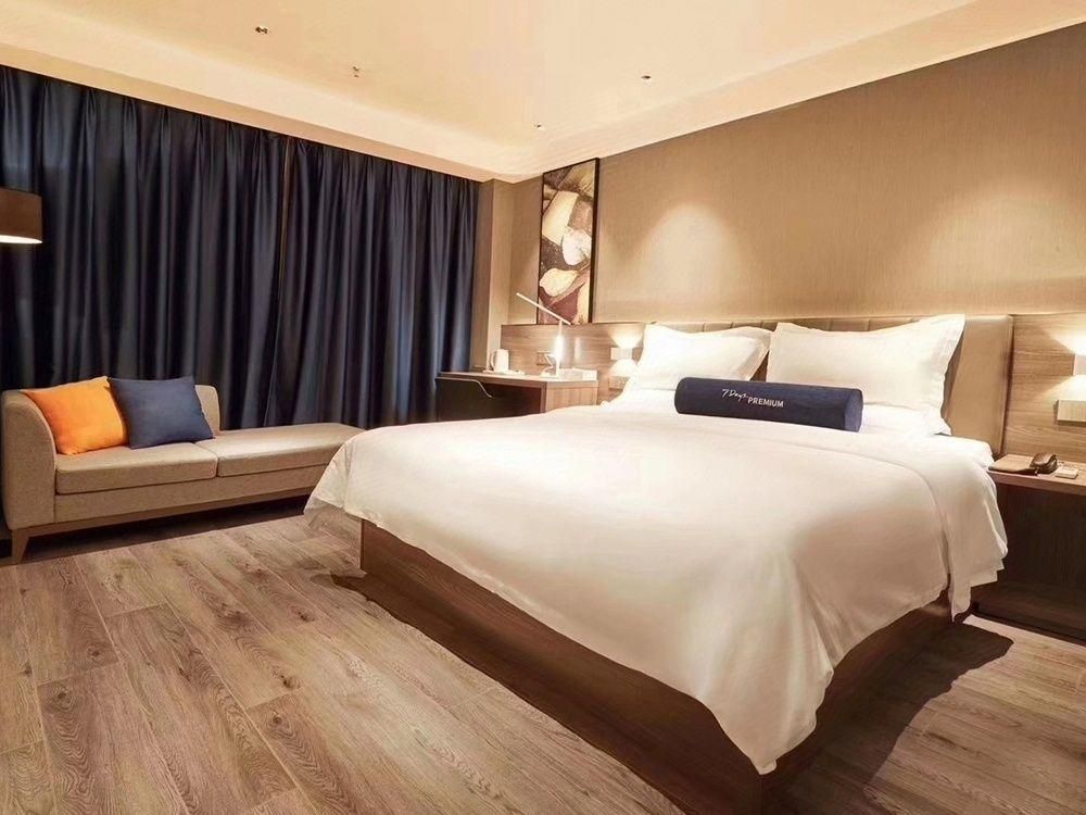 7 Days Premium Hotel (Heze Huanghe Road) - Heze - Спальня