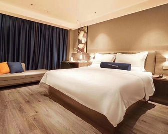 7 Days Premium Hotel (Heze Huanghe Road) - Heze - Спальня