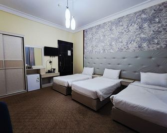 Al Asr almasi Suite Apartments - Medine - Yatak Odası
