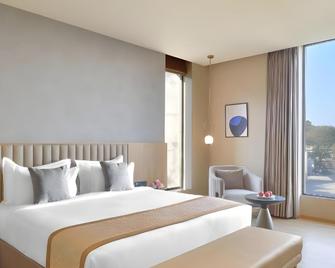 Treat Hotel Nashik City Center - Nashik - Slaapkamer