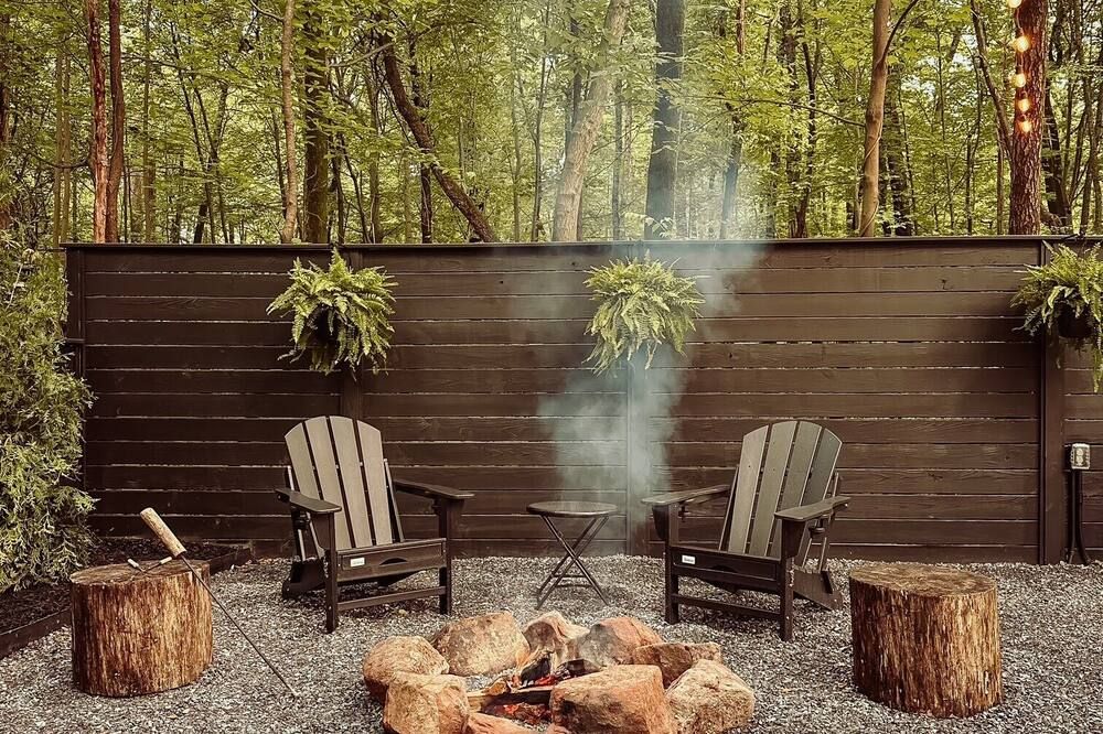 A luxurious glamping tent nestled in the trees.