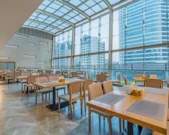 Venus International Hotel Kunming Baiyun Road Tongde Square - Kunming - Restaurante