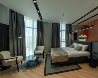 Dostyk Business Hotel - Aqtau - Schlafzimmer