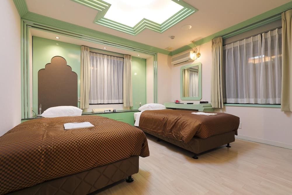 Reco Hotel Mikuni - Toyonaka - Schlafzimmer