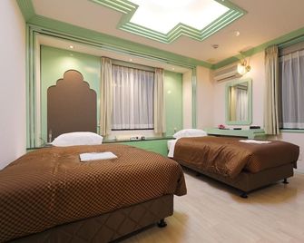 Reco Hotel Mikuni - Toyonaka - Schlafzimmer