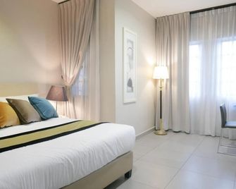 Country Inn - Kulai - Ložnice