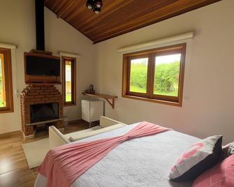 Pousada das Flores - Gonçalves - Quarto