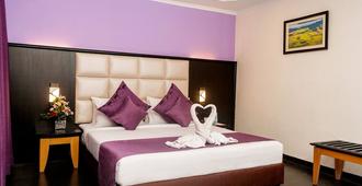 Indismart Hotel - Kolkata - Bedroom
