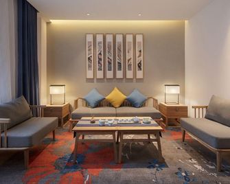Qianna Hotel (Xinxiang Hualan Avenue Pangdonglai Shopping Plaza) - Xinxiang - Wohnzimmer