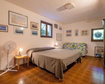 Casa al mare con ampia veranda - Stintino - Habitación