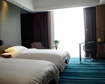 Jinjiang Metropolo Hotel Zhenjiang Railway Station Wanda Plaza - Zhenjiang - Soveværelse