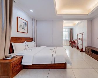 Baotou Junlinge Hotel (Zhengxiang International Wanda Plaza) - Baotou - Bedroom
