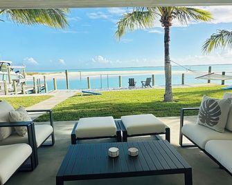 Oceanfront 5-bedroom 3-bath house with 50' Dock & optional 6 seater golf cart - Treasure Cay - Patio