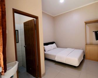 Shofy Guest House Syariah 33 Subang - Subang - Kamar Tidur