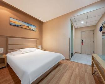 Grace Inn Dezhou Development Zone - Dezhou - Bedroom