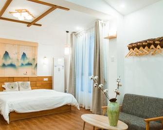 Listening To The Rain Hall Inn - Zhangjiajie - Bedroom