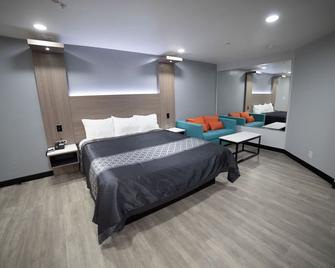 Express Inn & Suites - אונטריו - חדר שינה