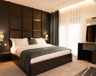 Ador Hotel - Pristina - Schlafzimmer