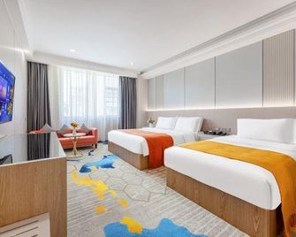 Jinyatai Business Hotel - גואנגג'ואו - חדר שינה