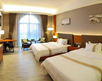 Xibian Hotel (Tai Shan Na Qin Peninsula Scenic Area Weijiaowan Branch) - Yangjiang - Bedroom