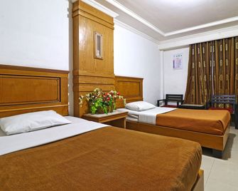 Hotel Sas Syariah - Banjarmasin - Camera da letto