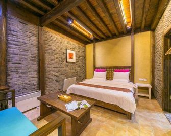 Blossom Hill Inn Lijiang Eminentland - ליז'יאנג - חדר שינה