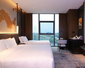 Howard Johnson By Wyndham Guotou Plaza Zigong - Zigong - Bedroom