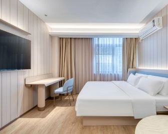 Hanting Hotel Nanjing Pukou Nanda - Nanjing - Schlafzimmer