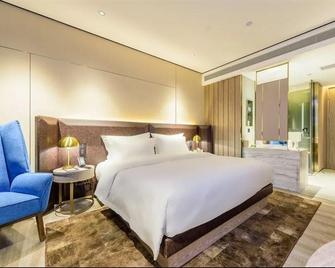 Echarm Plus Hotel Nanning Railway Station Chaoyang Square - Nanning - Bedroom