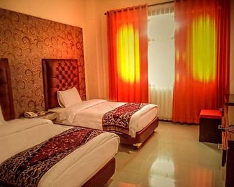 Grand City Hotel Batu - Batu - Schlafzimmer