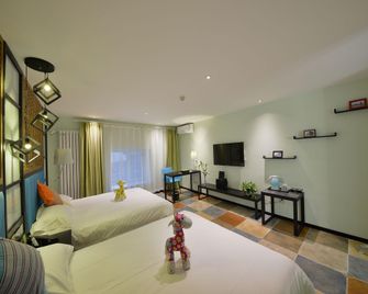 Harbin Blue Feather Hotel - חרבין - חדר שינה