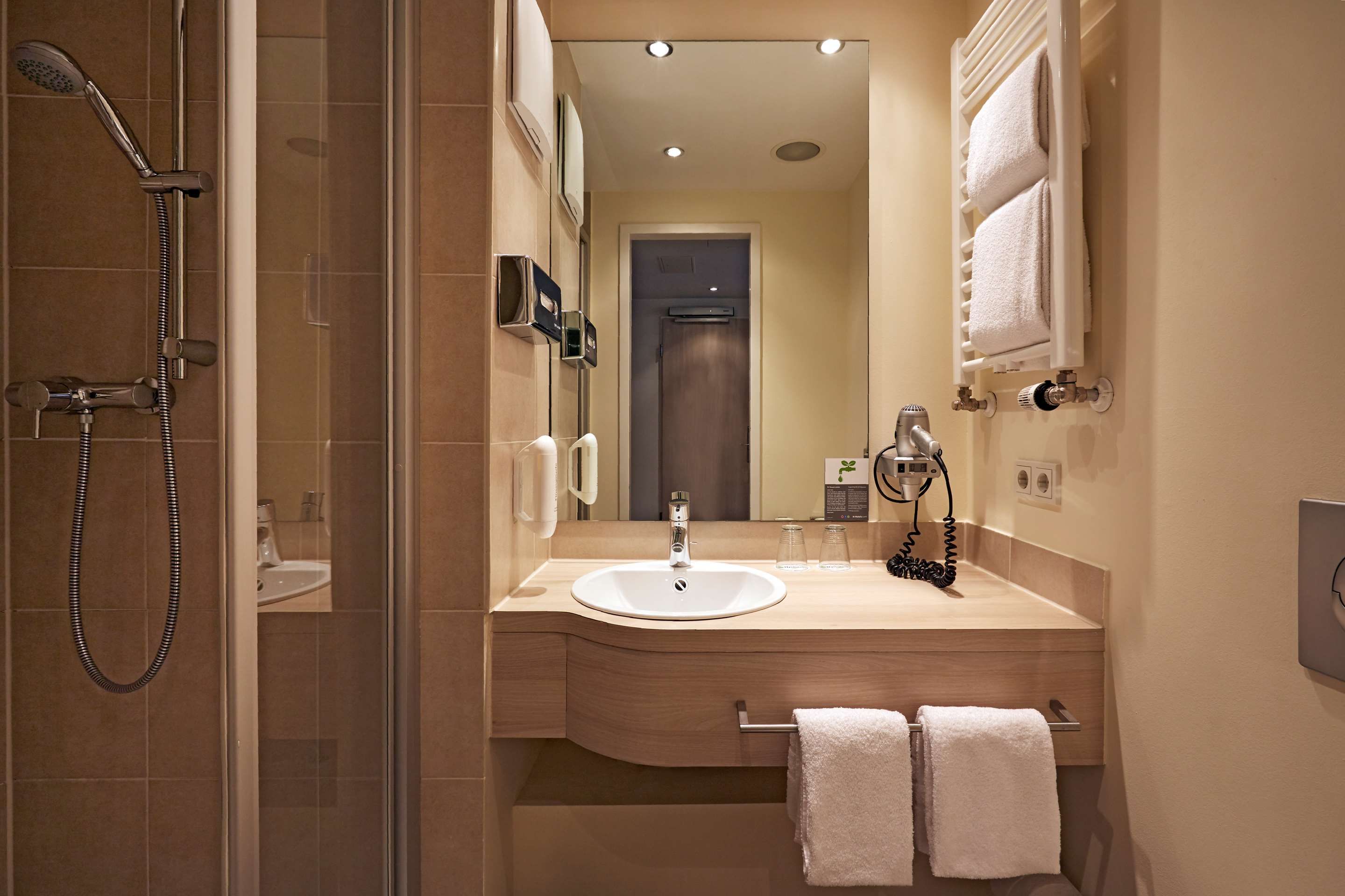 Bathroom view of H+ Hotel München