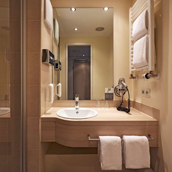 Bathroom view of H+ Hotel München